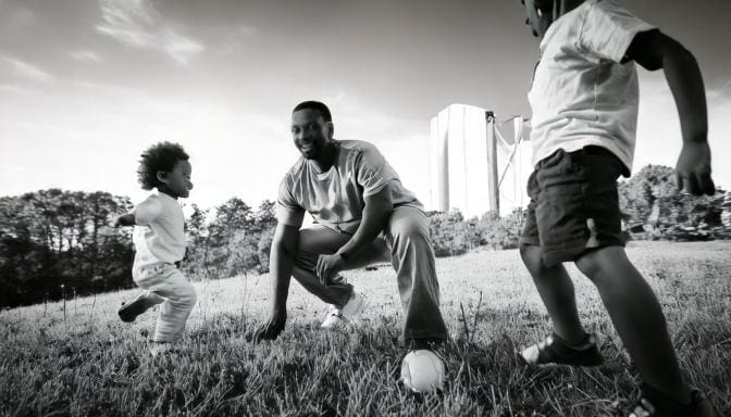 Father engaged and playing with kids-family in activity