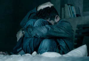 dramatic portrait of depressed and sick man suffering