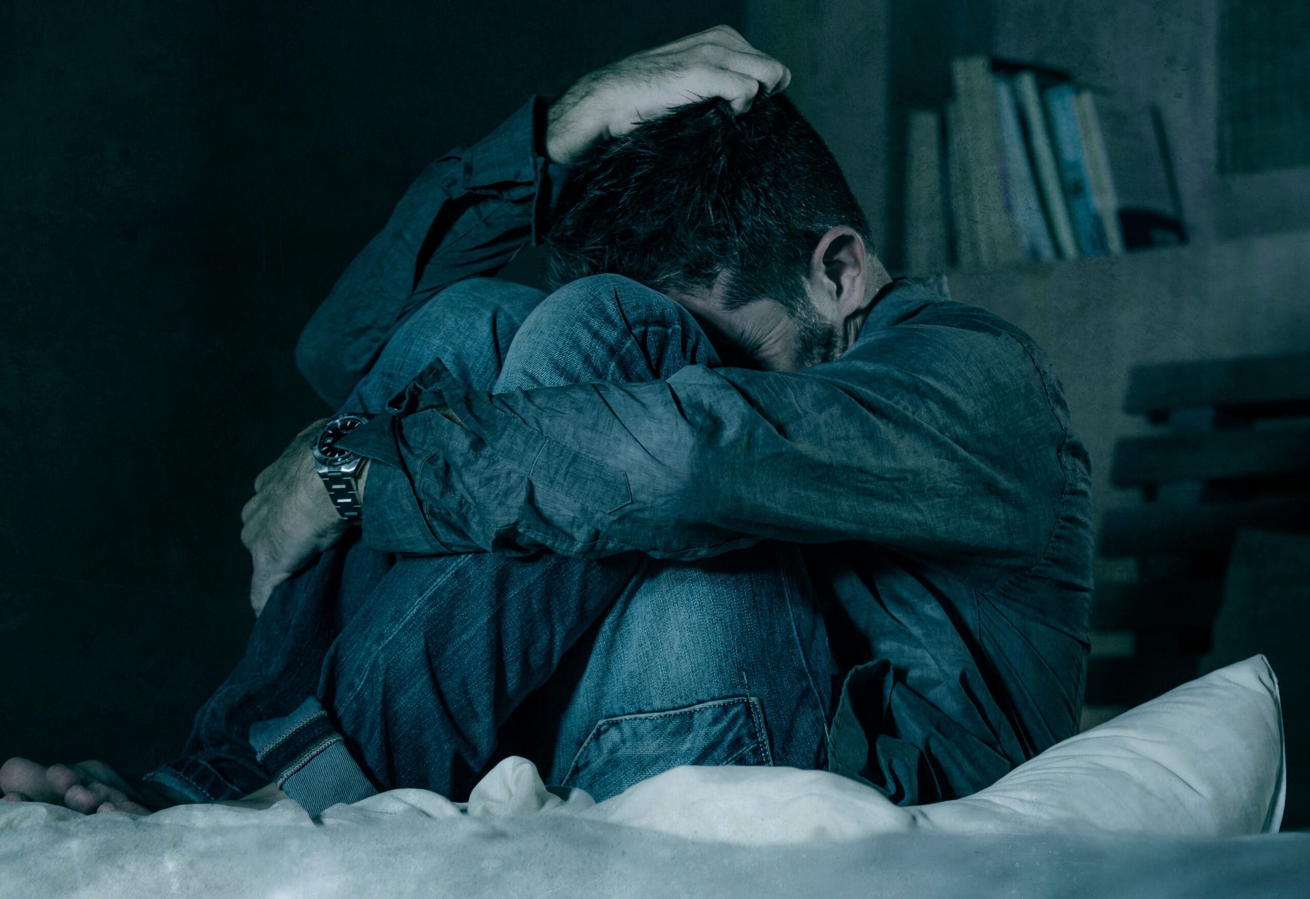 dramatic portrait of depressed and sick man suffering